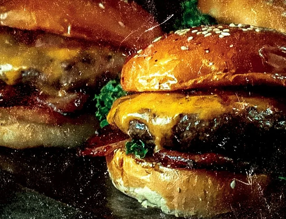 Delicious Crack Burgers served with fresh toppings and sauces.