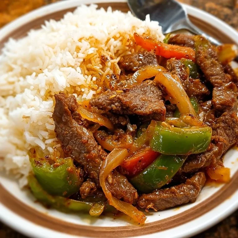 Delicious plate of pepper steak with juicy sliced beef and vibrant bell peppers